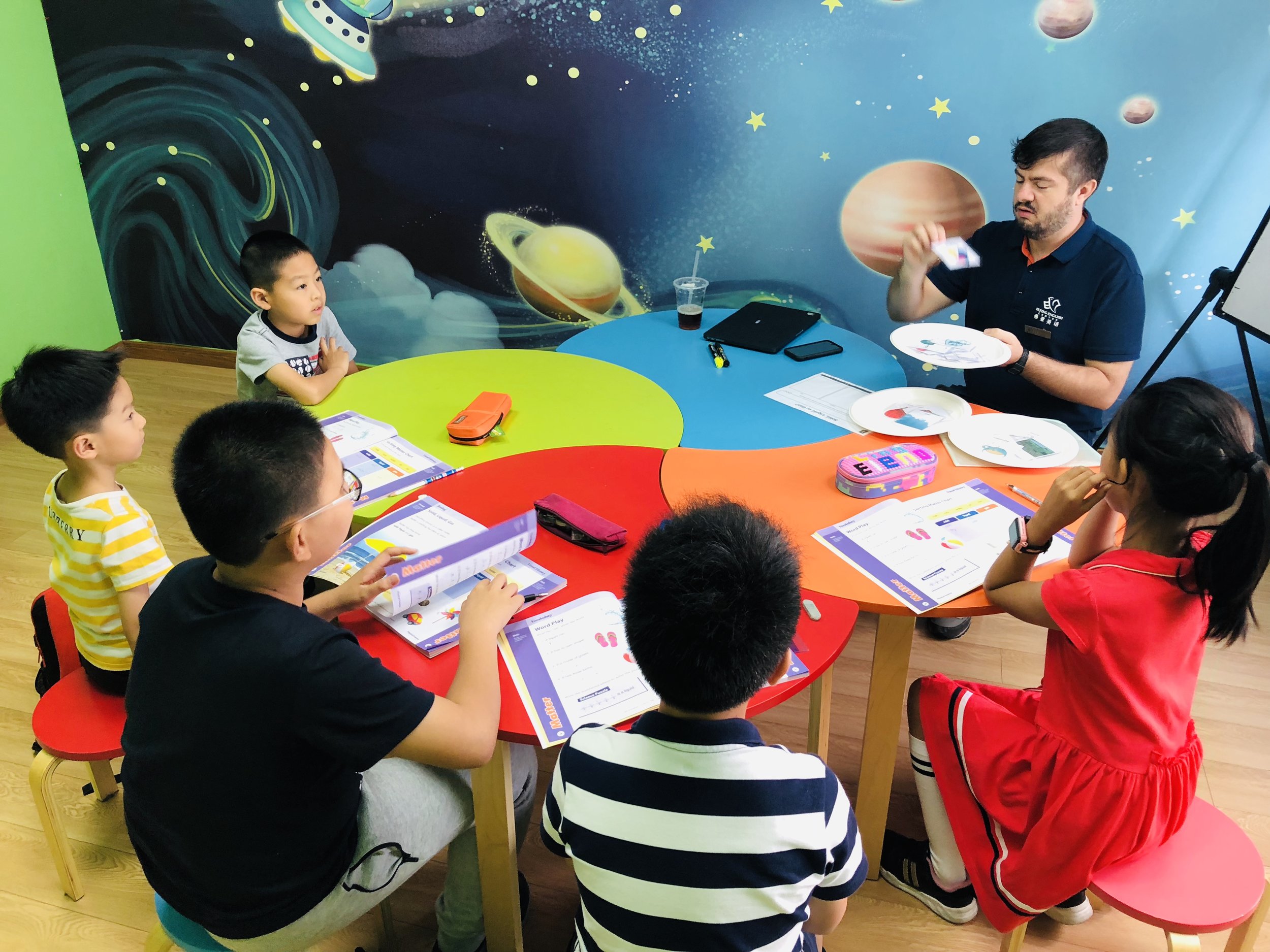 Teacher helping a child read
